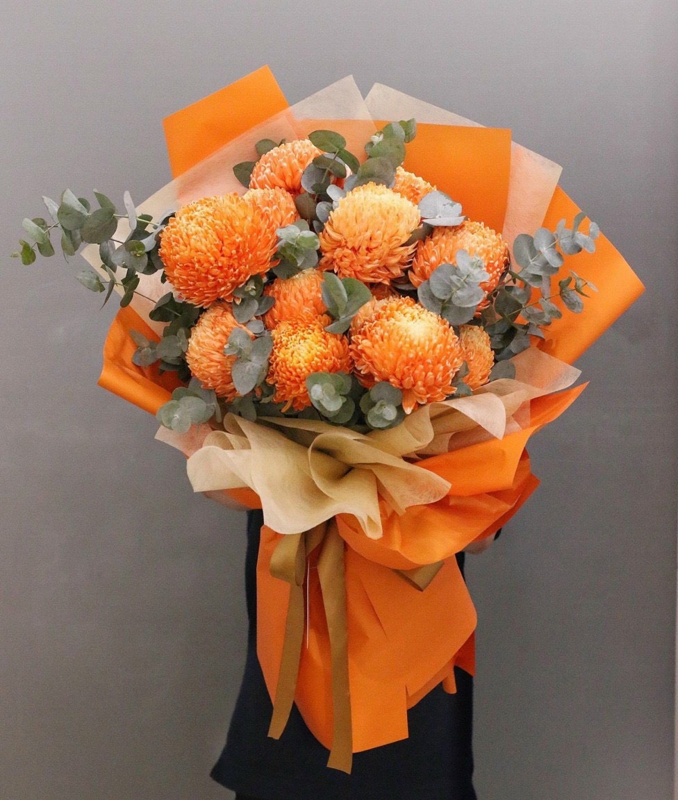 Unique bouquet of orange peony chrysanthemums